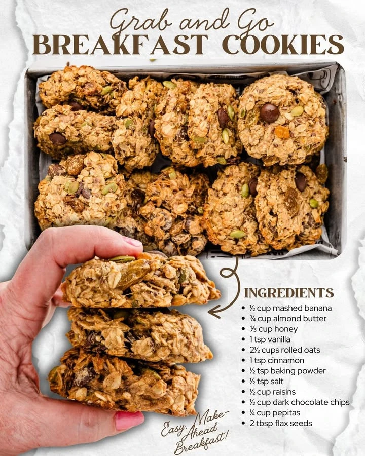 A plate of homemade breakfast cookies packed with nuts and dried fruits.