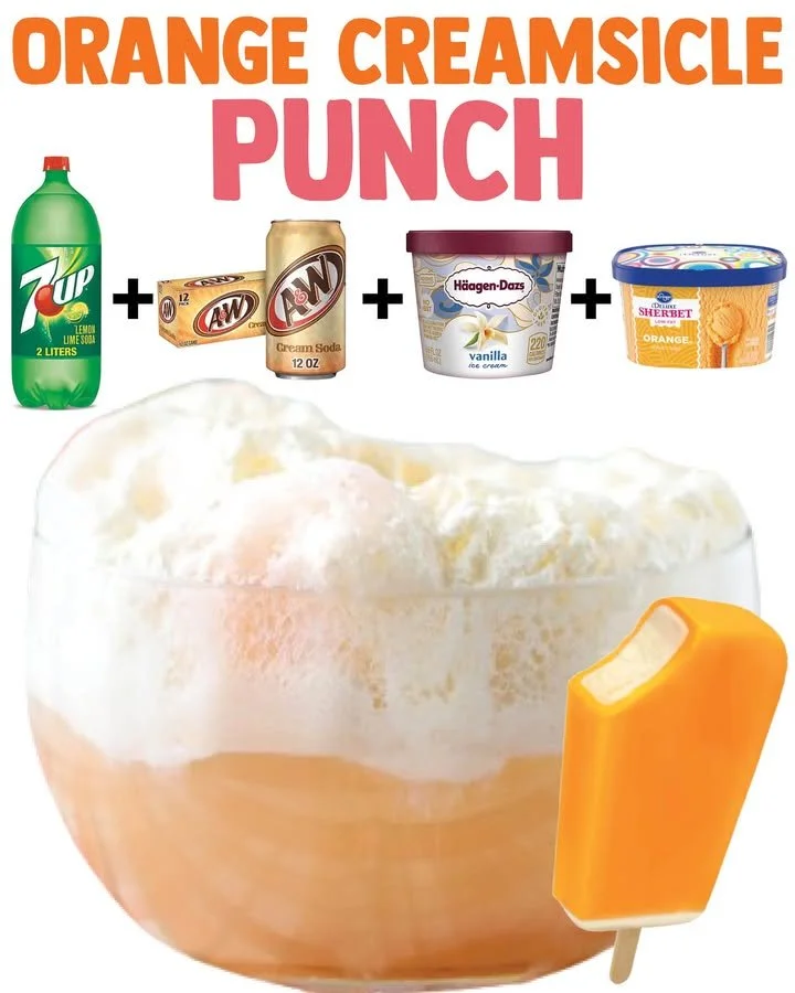 A refreshing glass of Dreamsicle Punch garnished with orange slices.