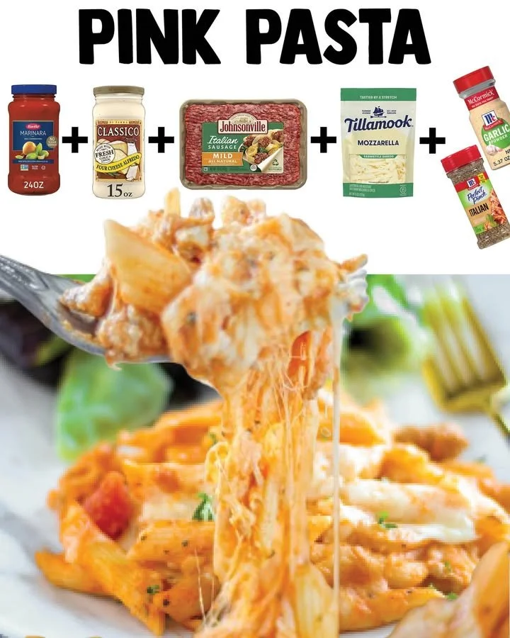 Creamy pink pasta dish served on a plate with fresh herbs
