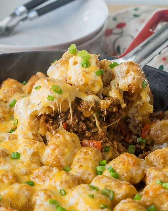 Sloppy Joe Tater Tots served with toppings on a plate