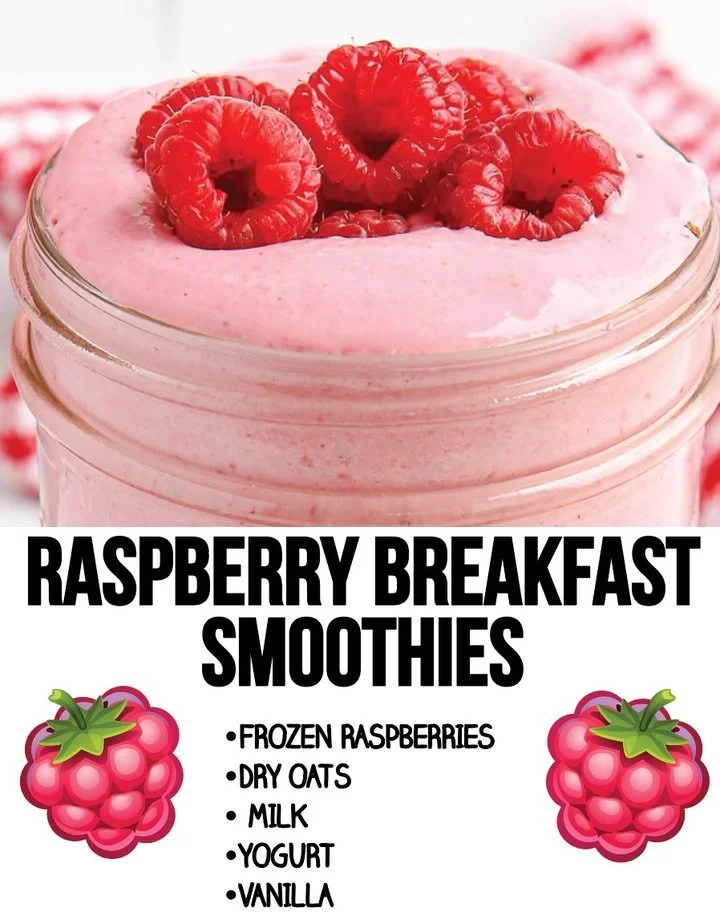 A delicious raspberry smoothie served in a glass, garnished with fresh berries.