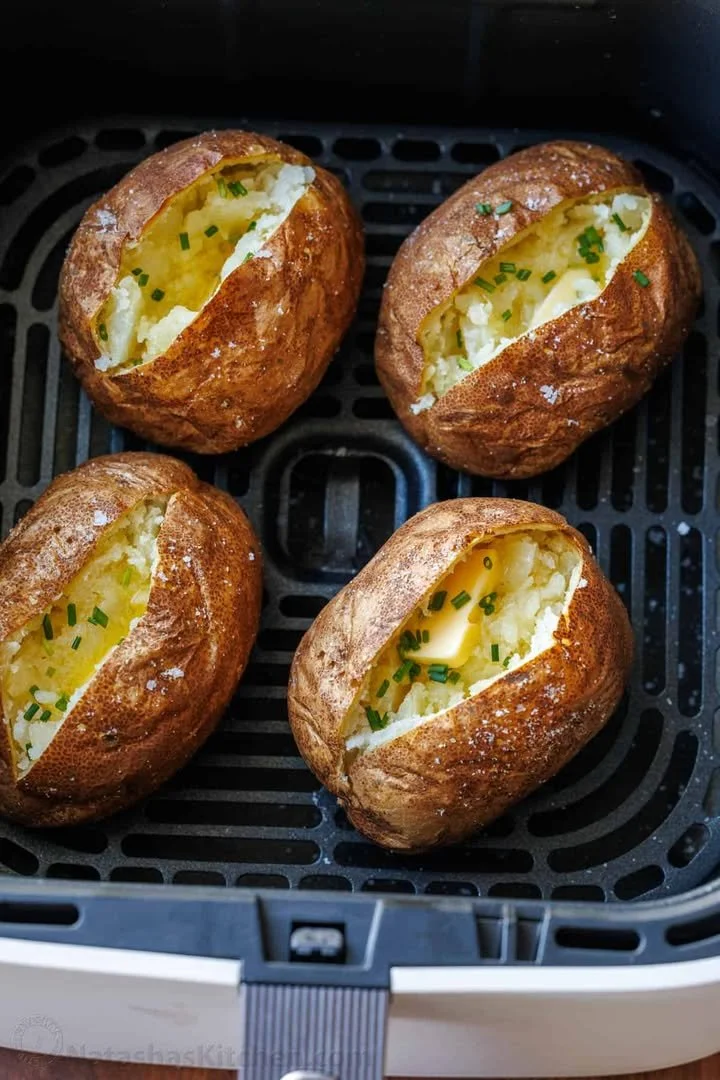 Crispy air fryer baked potatoes ready to be served.