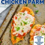 Plate of baked chicken parmesan with melted cheese and marinara sauce