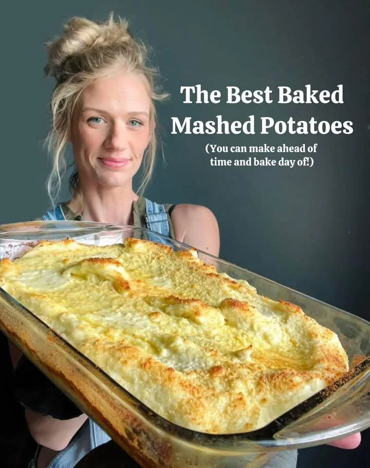 Delicious baked mashed potatoes topped with cheese and herbs in a baking dish.