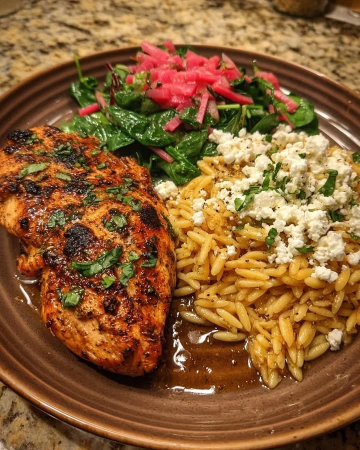 Balsamic glazed chicken with orzo, feta cheese, and herbed rhubarb relish plate