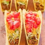Delicious beef tacos served with fresh toppings and salsa