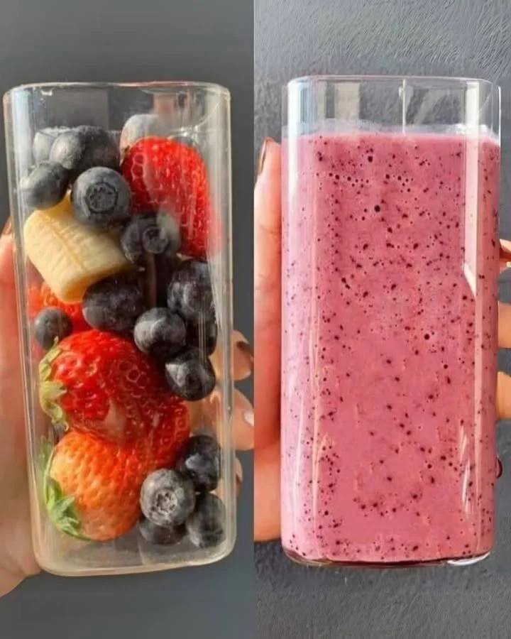 Delicious Berry Banana Smoothie in a glass with fresh berries and banana slices