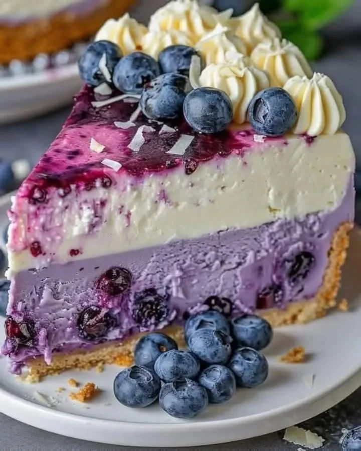Delicious blueberry cheesecake topped with fresh blueberries and cream cheese filling.