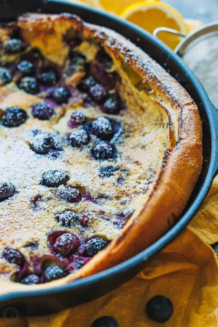 Blueberry Lemon Dutch Baby topped with fresh blueberries and lemon zest
