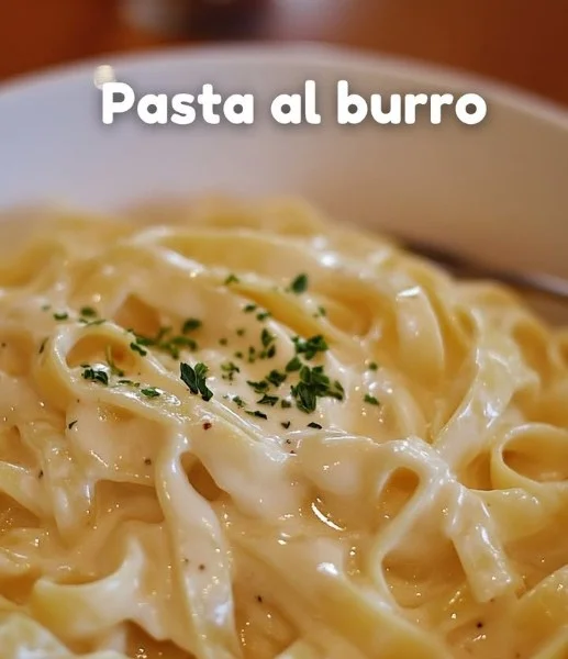Delicious plate of butter pasta topped with parmesan and herbs