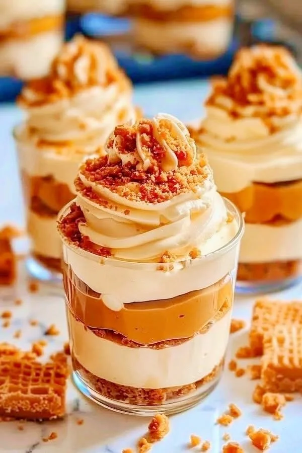 Delicious butterscotch caramel cheesecake cups with creamy topping