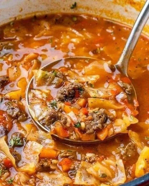 Bowl of delicious cabbage roll soup with vegetables and meat