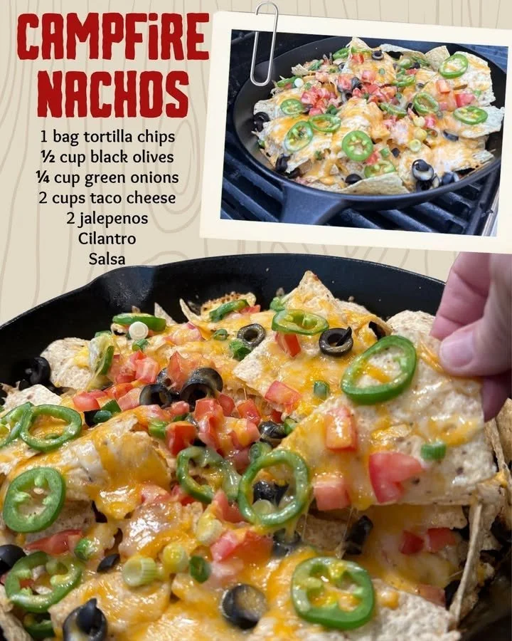 Delicious campfire nachos served in a skillet with cheese and toppings