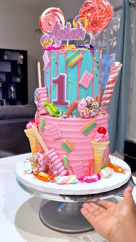 Candy Overload Cake topped with vibrant candies and fluffy frosting