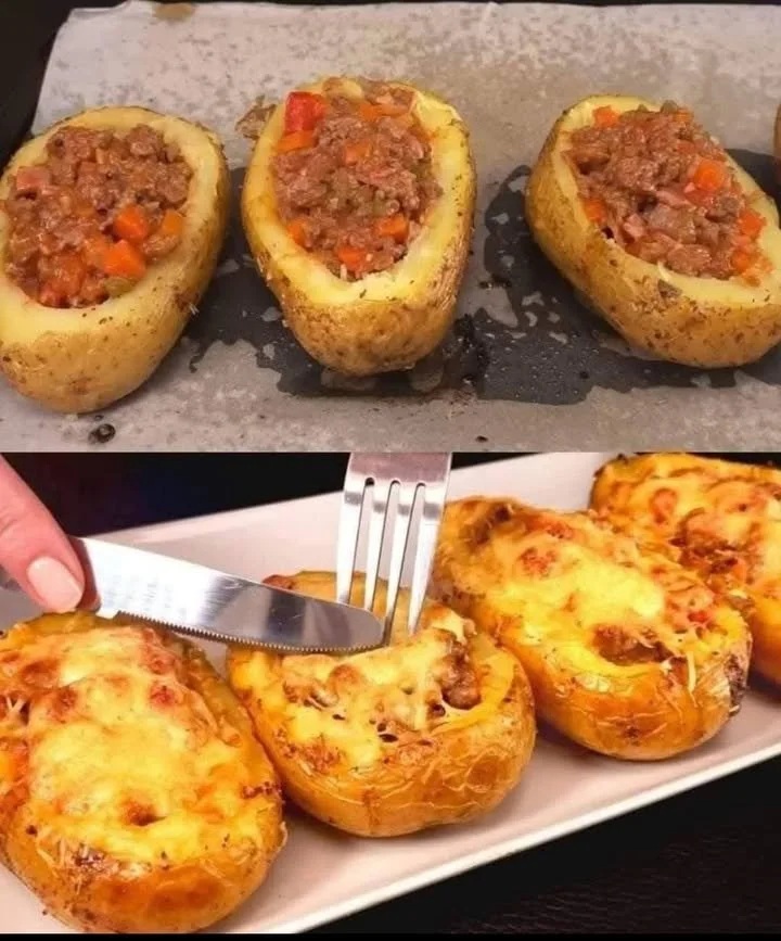 Cheesy beef stuffed potatoes topped with melted cheese and herbs
