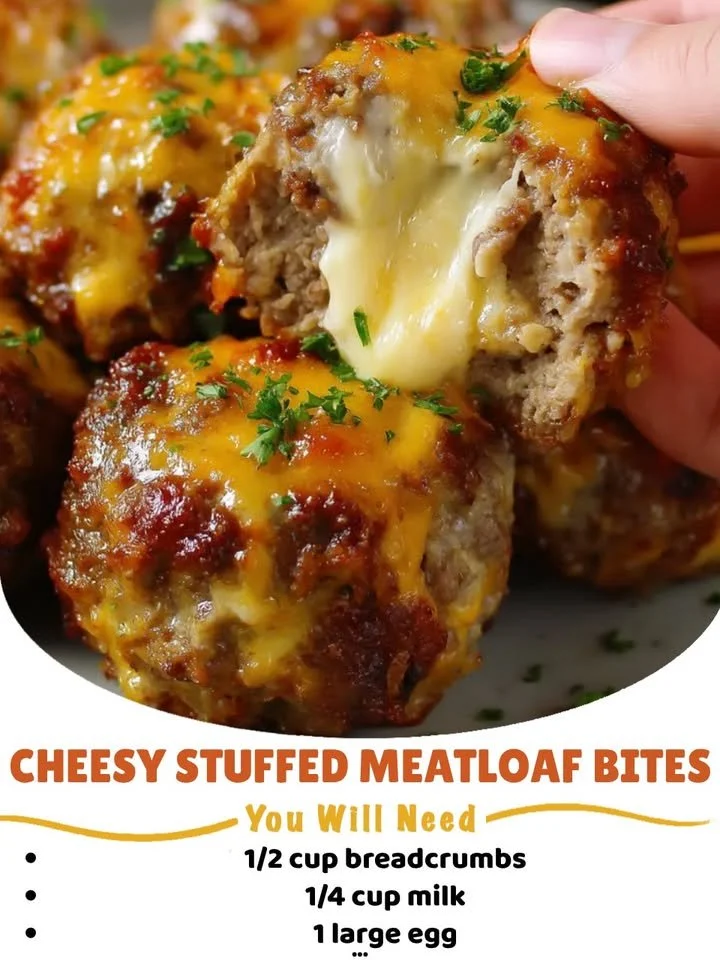 Cheesy stuffed meatloaf bites served on a platter with dipping sauce.
