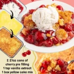 Delicious cherry dump cake served in a dish with a scoop of ice cream.