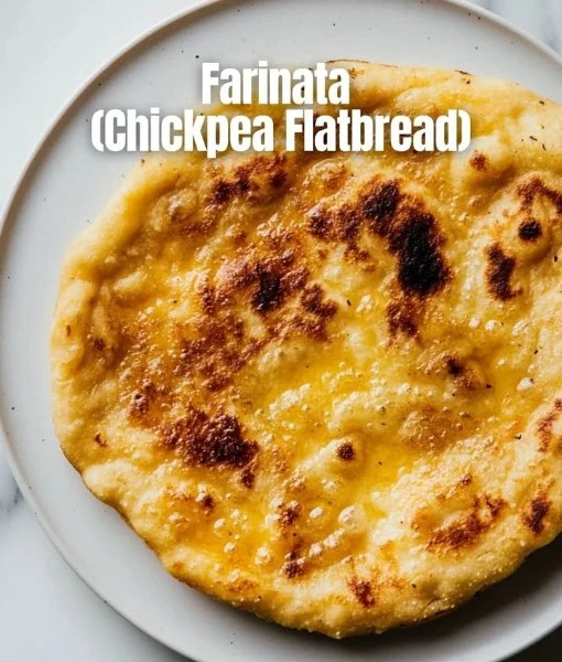 Delicious homemade chickpea flatbread served with fresh herbs and vegetables.