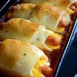 Delicious Chili Cheese Dog Bake served on a plate with toppings