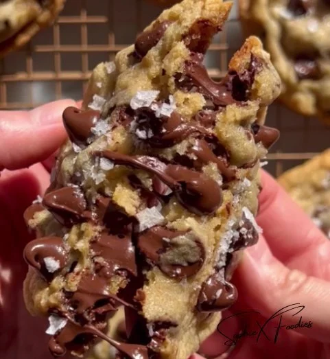 Freshly baked chocolate chip cookies on a cooling rack