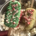 Festively decorated Christmas Cakesicles ready for holiday celebrations