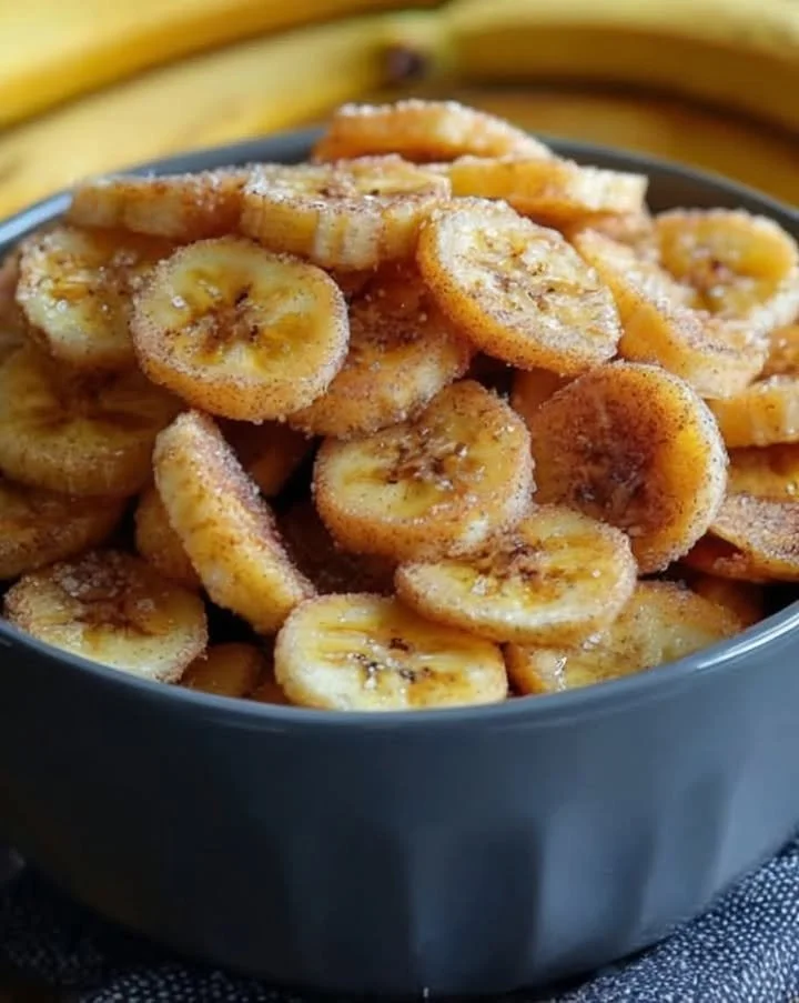 Cinnamon-sugar air fryer banana chips in a bowl, perfect snack option.