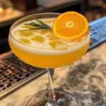 Citrus New Year Glow Punch in a festive glass with colorful citrus slices