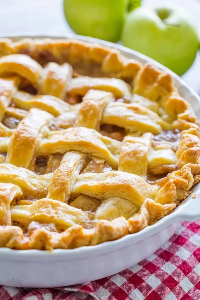 Delicious classic apple pie with golden crust and sliced apples