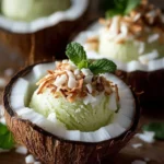 Coconut-Mint Sorbet served in coconut shells, a fresh and tropical dessert.