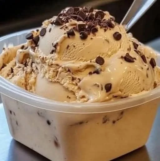 Delicious coffee ice cream served in a bowl with a spoon