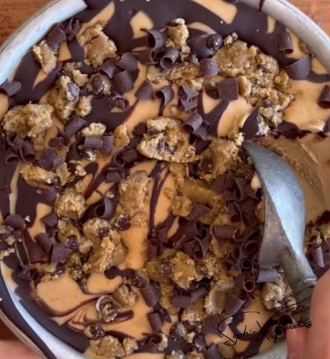 Delicious coffee ice cream with cookie dough bits and fudge swirl in a bowl