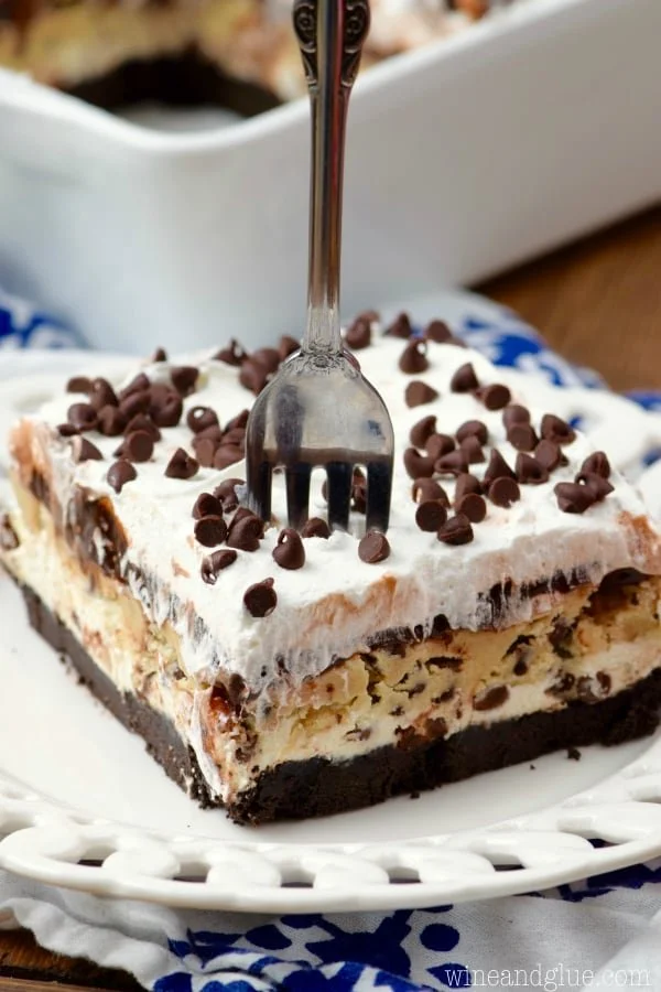 Delicious Cookie Dough Lush dessert topped with cookie pieces and cream