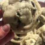 Delicious cookies and cream frosting stuffed cookies on a plate