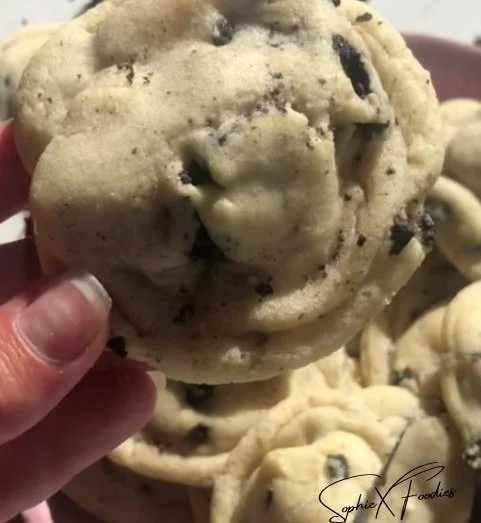 Delicious cookies and cream frosting stuffed cookies on a plate
