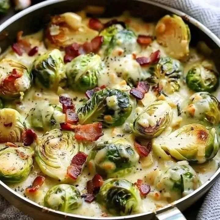 Creamy garlic parmesan bacon Brussels sprouts topped with crispy bacon