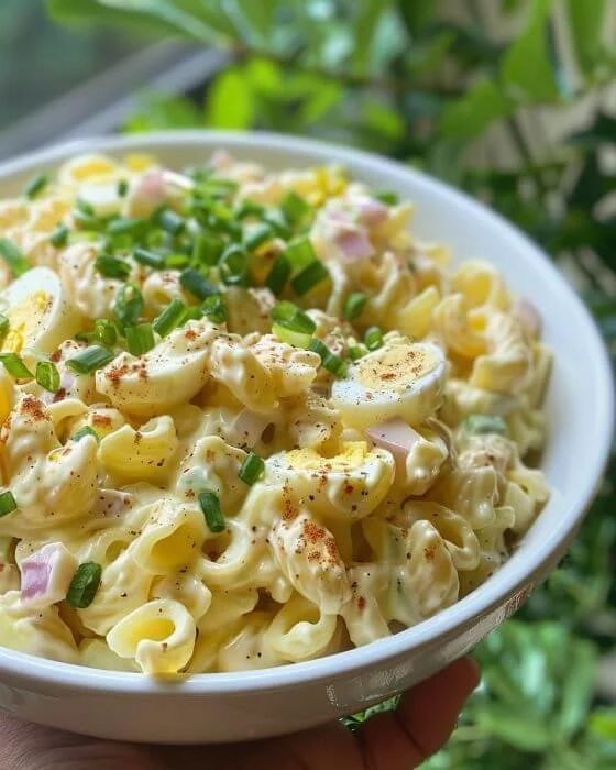 Delicious deviled egg pasta salad served in a colorful bowl.