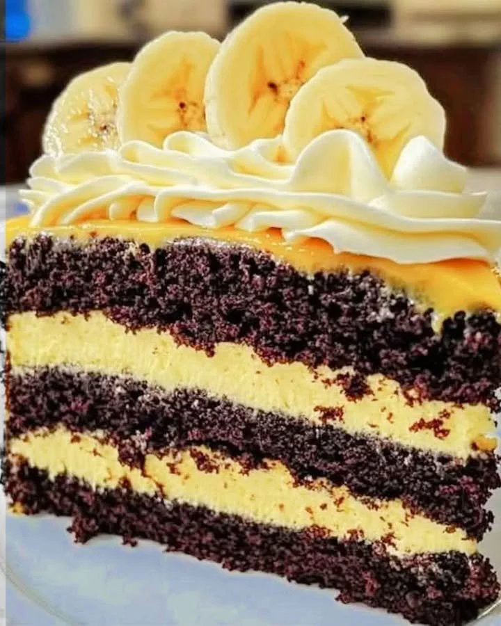 Double chocolate banana layer cake with chocolate frosting and banana slices