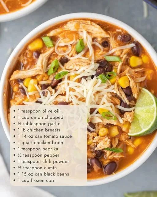 Bowl of easy chicken taco soup garnished with cilantro and tortilla chips