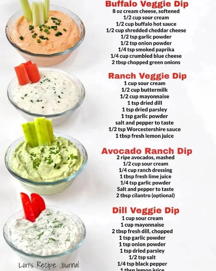 Four varieties of homemade vegetable dips served with fresh veggies