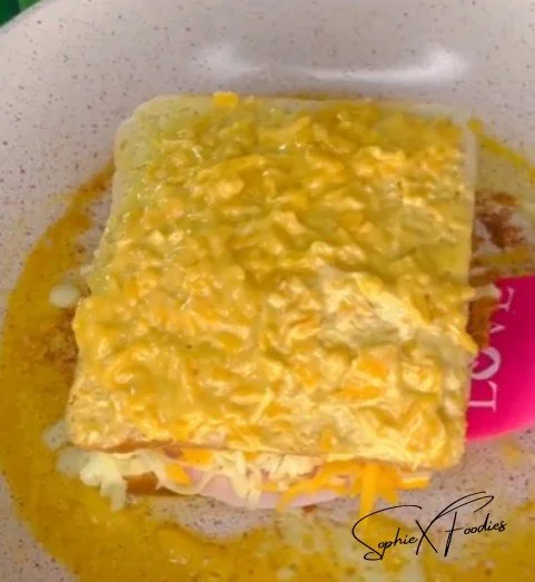 Garlic Butter Bread with Ham, Eggs, and Cheese on a plate