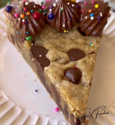 Delicious giant cookie cake with colorful frosting and sprinkles