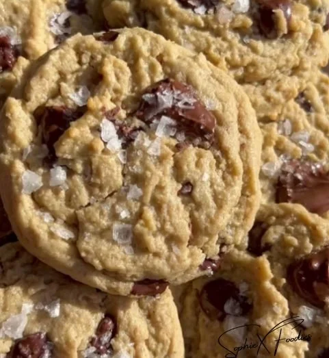 Gluten-free chocolate chip cookies on a plate, freshly baked and golden brown.