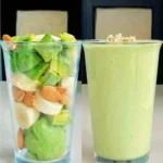 Fresh green smoothie with spinach, bananas, and apples in a glass