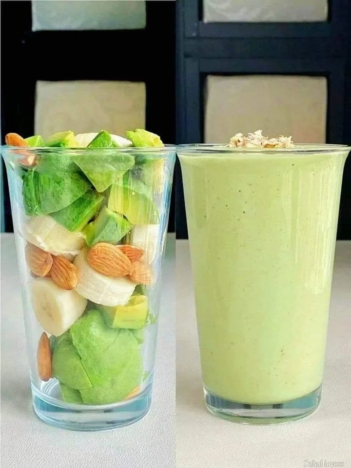 Fresh green smoothie with spinach, bananas, and apples in a glass