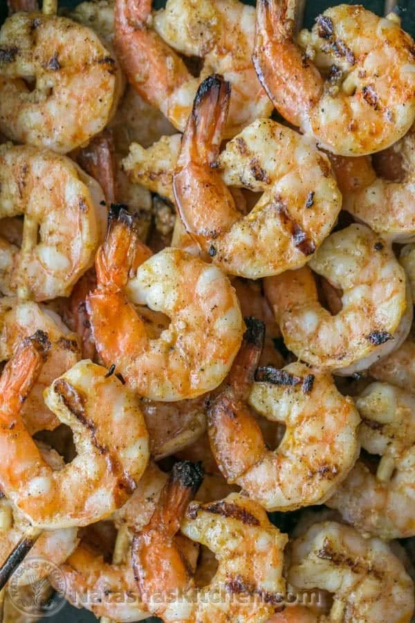 Delicious grilled shrimp skewers ready to be served at a summer barbecue.