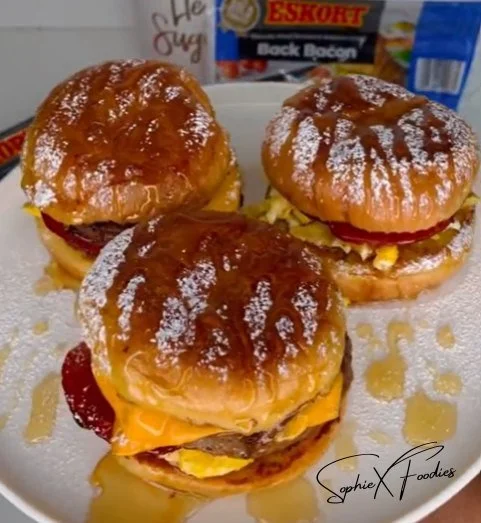 Delicious Hamburger Bun French Toast on a plate with syrup and berries