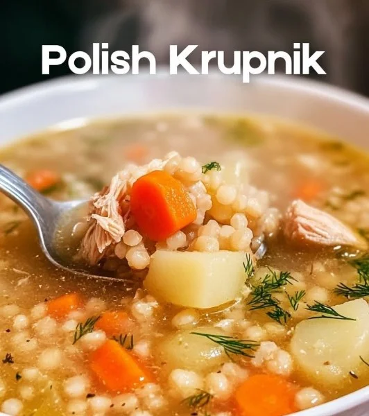 Bowl of hearty Polish Barley Soup garnished with fresh herbs