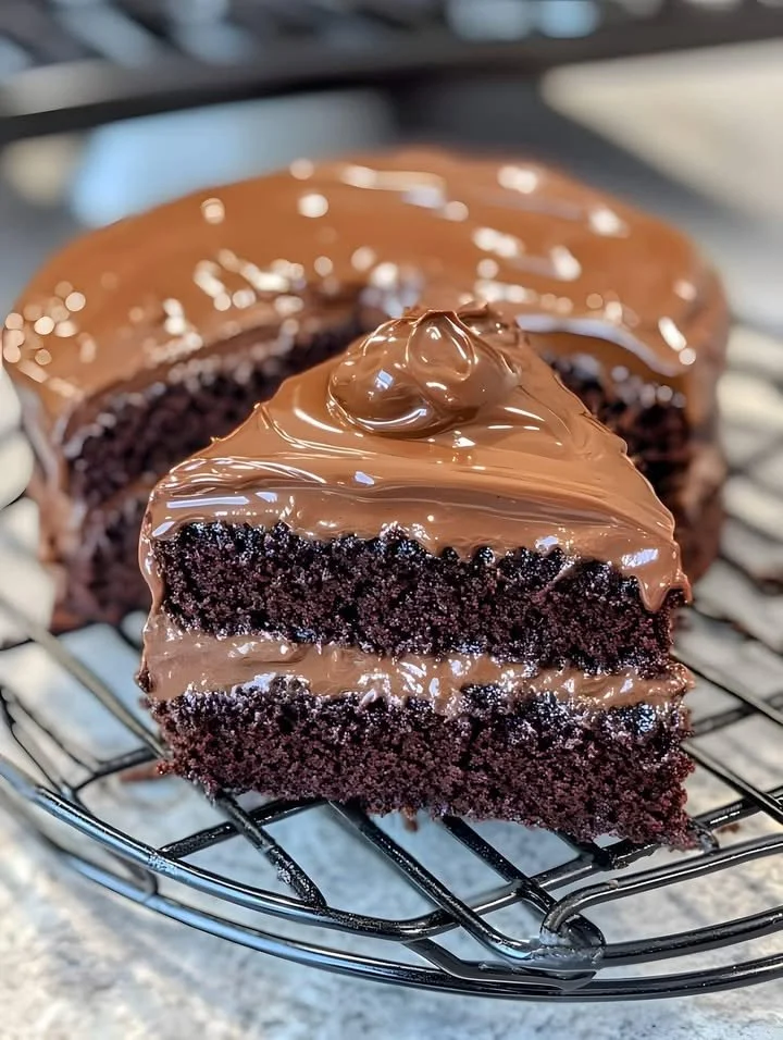 Delicious homemade chocolate cake with rich frosting and chocolate shavings
