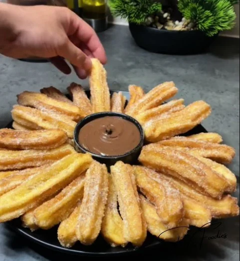Homemade churros served with chocolate dipping sauce