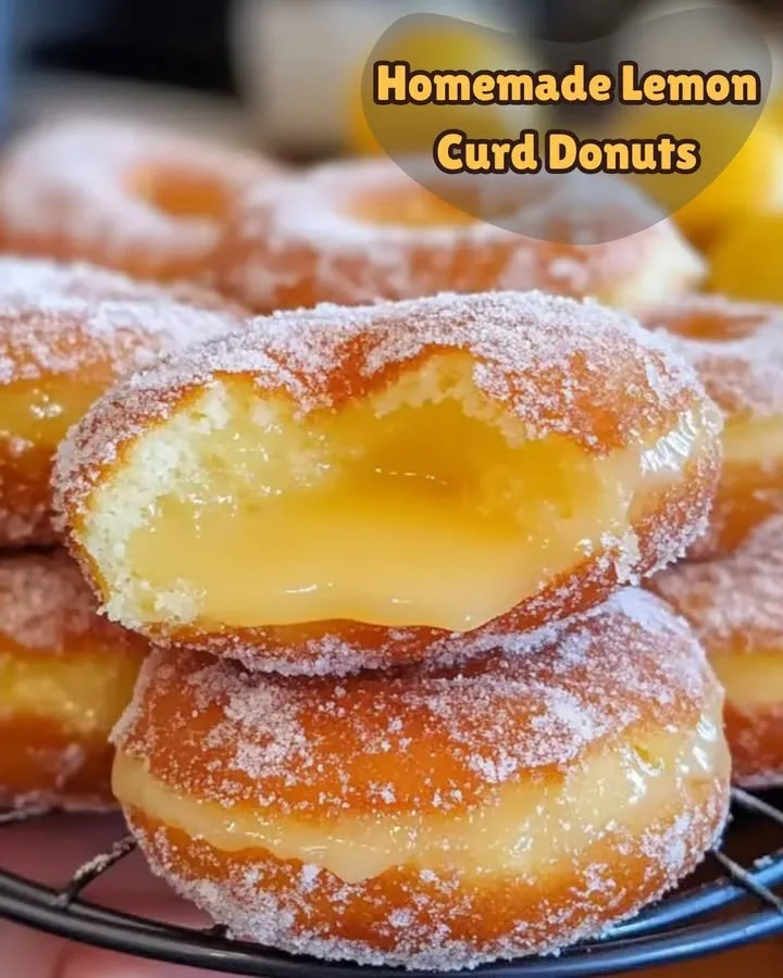 Homemade lemon curd donuts topped with glaze and lemon zest
